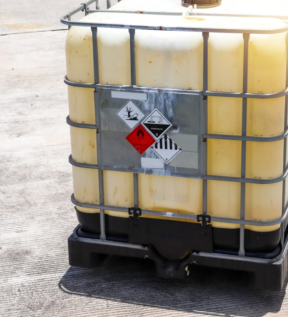 Warning symbol for chemical hazard on chemical container, chemical in factory